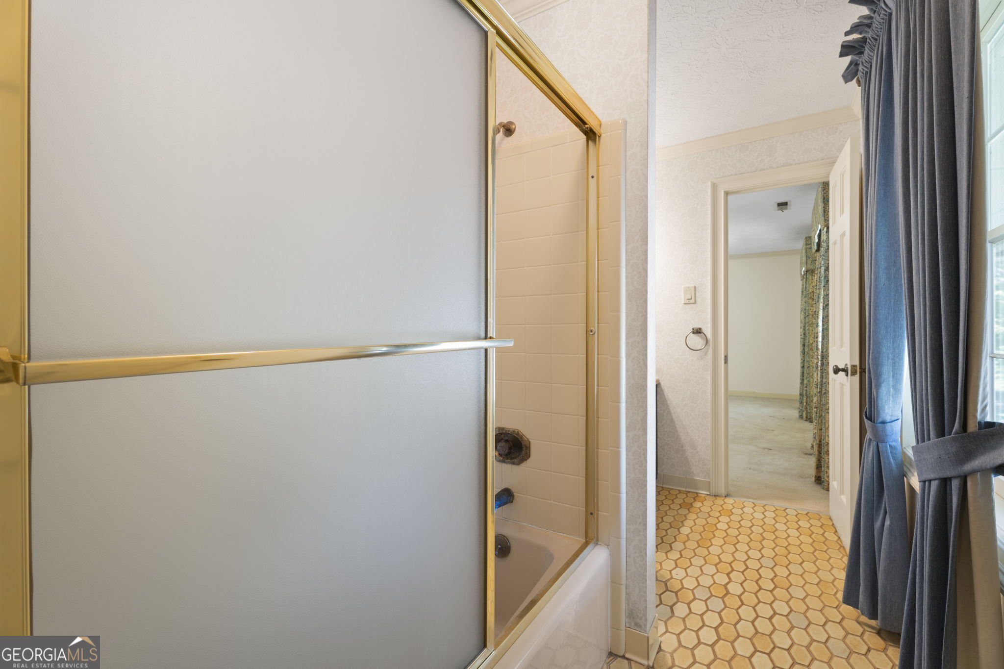 1080 Conyers Road McDonough, GA 30252 - Photo 32 of 55 a bathroom with a glass shower door