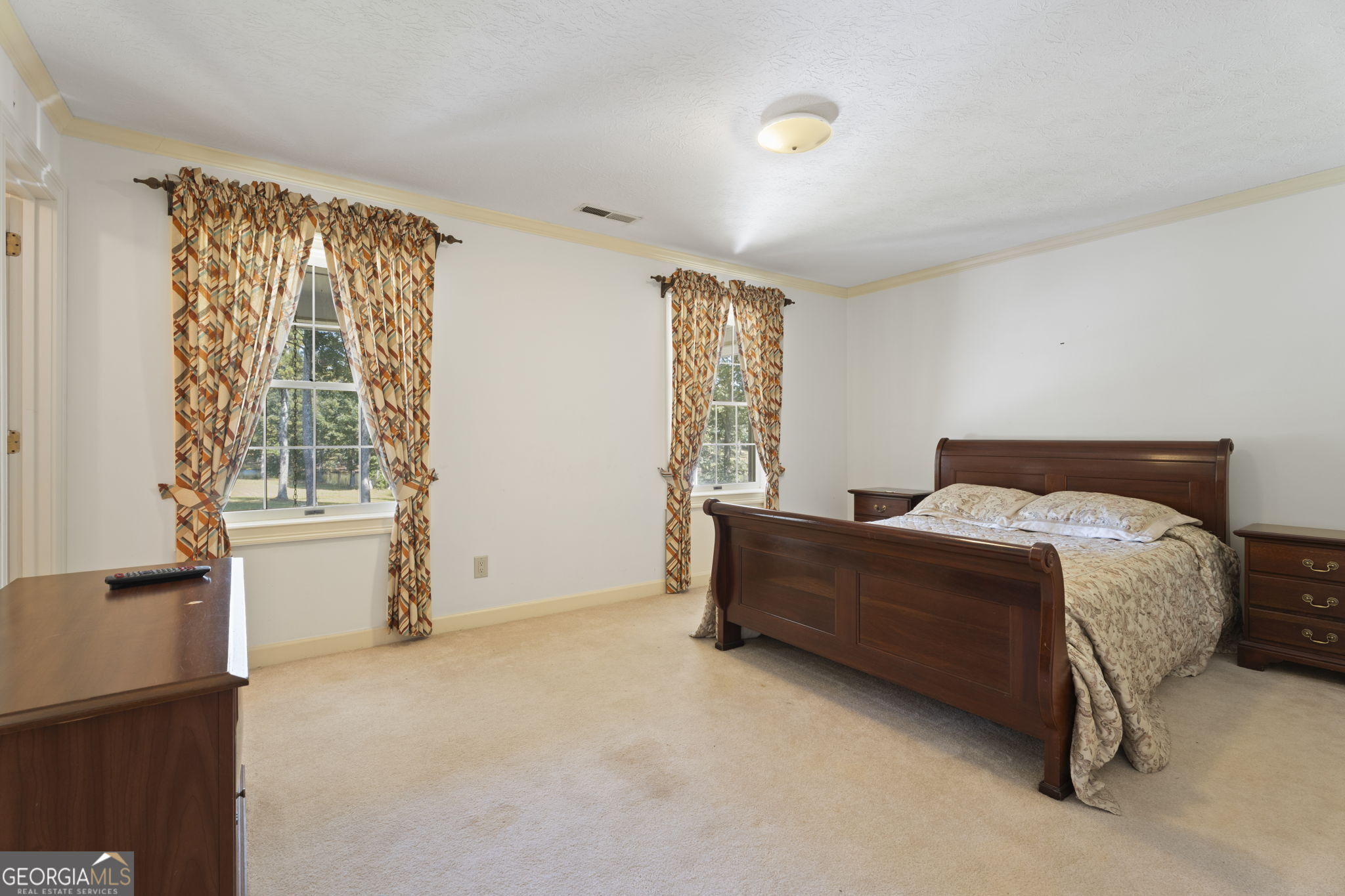 1080 Conyers Road McDonough, GA 30252 - Photo 33 of 55 a bed room with a bed and a chair