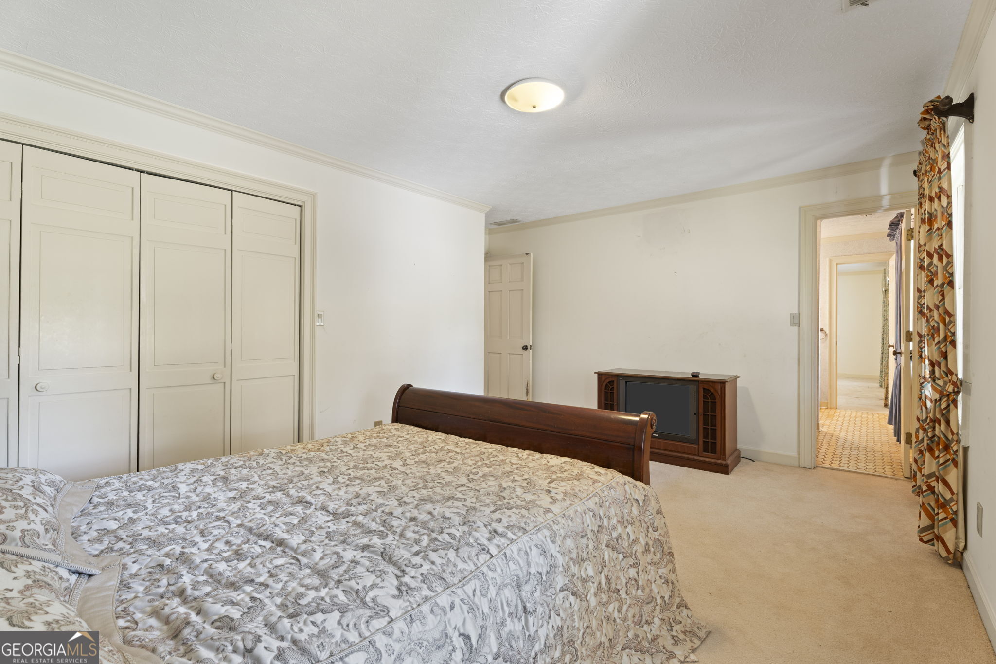 1080 Conyers Road McDonough, GA 30252 - Photo 35 of 55 a bedroom with a bed and a dresser