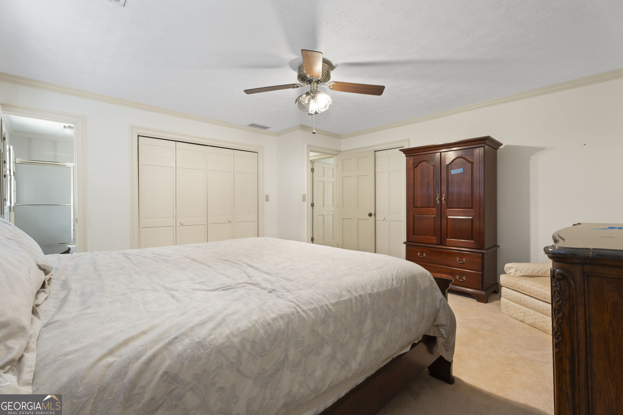 1080 Conyers Road McDonough, GA 30252 - Photo 37 of 55 a bedroom with a bed and a refrigerator