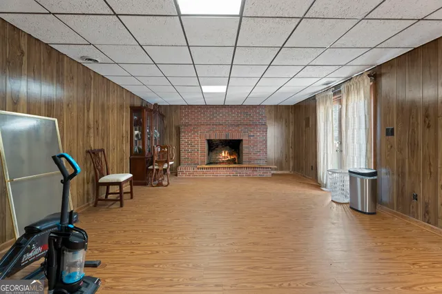 a view of a room with furniture window and wooden floor