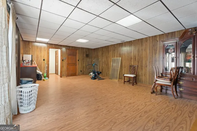 a view of a room with furniture and a large window