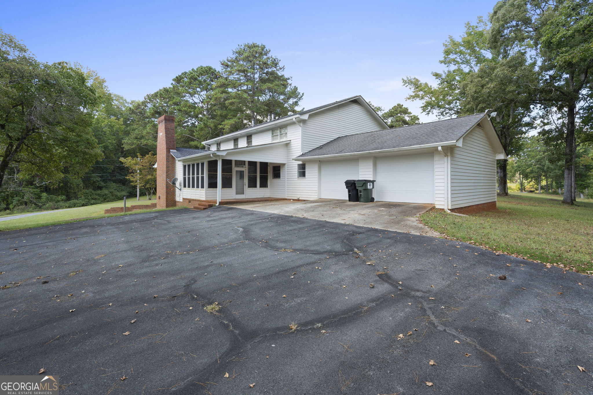 1080 Conyers Road McDonough, GA 30252 - Photo 49 of 55 a front view of a house with a yard and trees