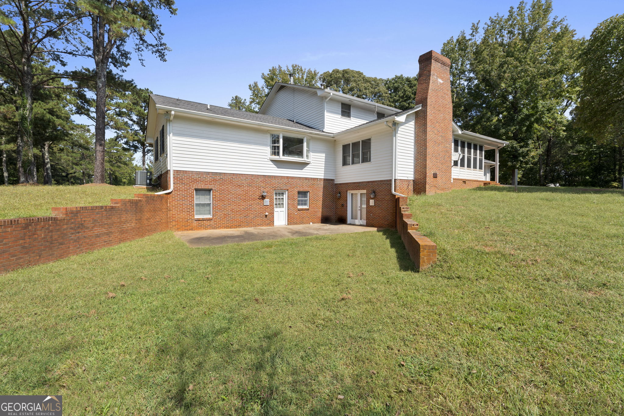 1080 Conyers Road McDonough, GA 30252 - Photo 51 of 55 a front view of a house with a yard and garage