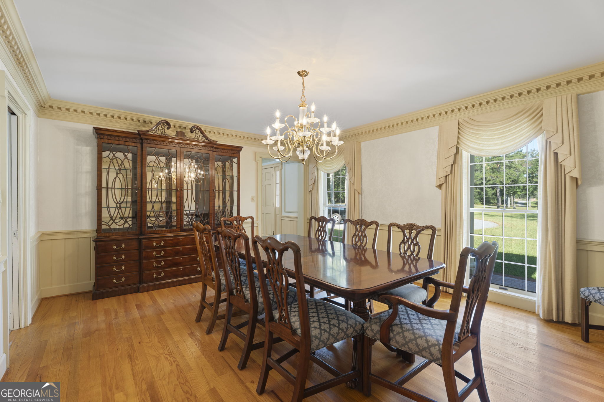 1080 Conyers Road McDonough, GA 30252 - Photo 8 of 55 a view of a dining room with furniture window and wooden floor
