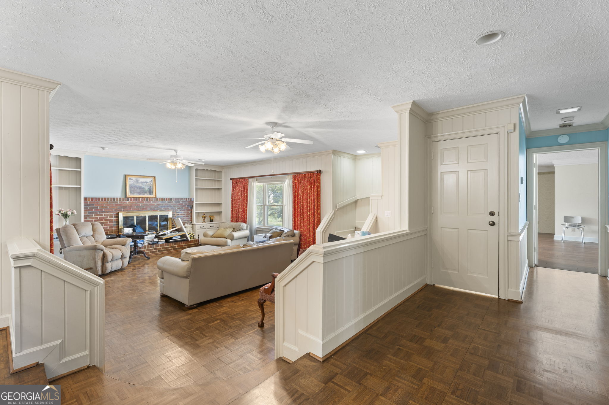 1080 Conyers Road McDonough, GA 30252 - Photo 10 of 55 a living room with furniture and a wooden floor