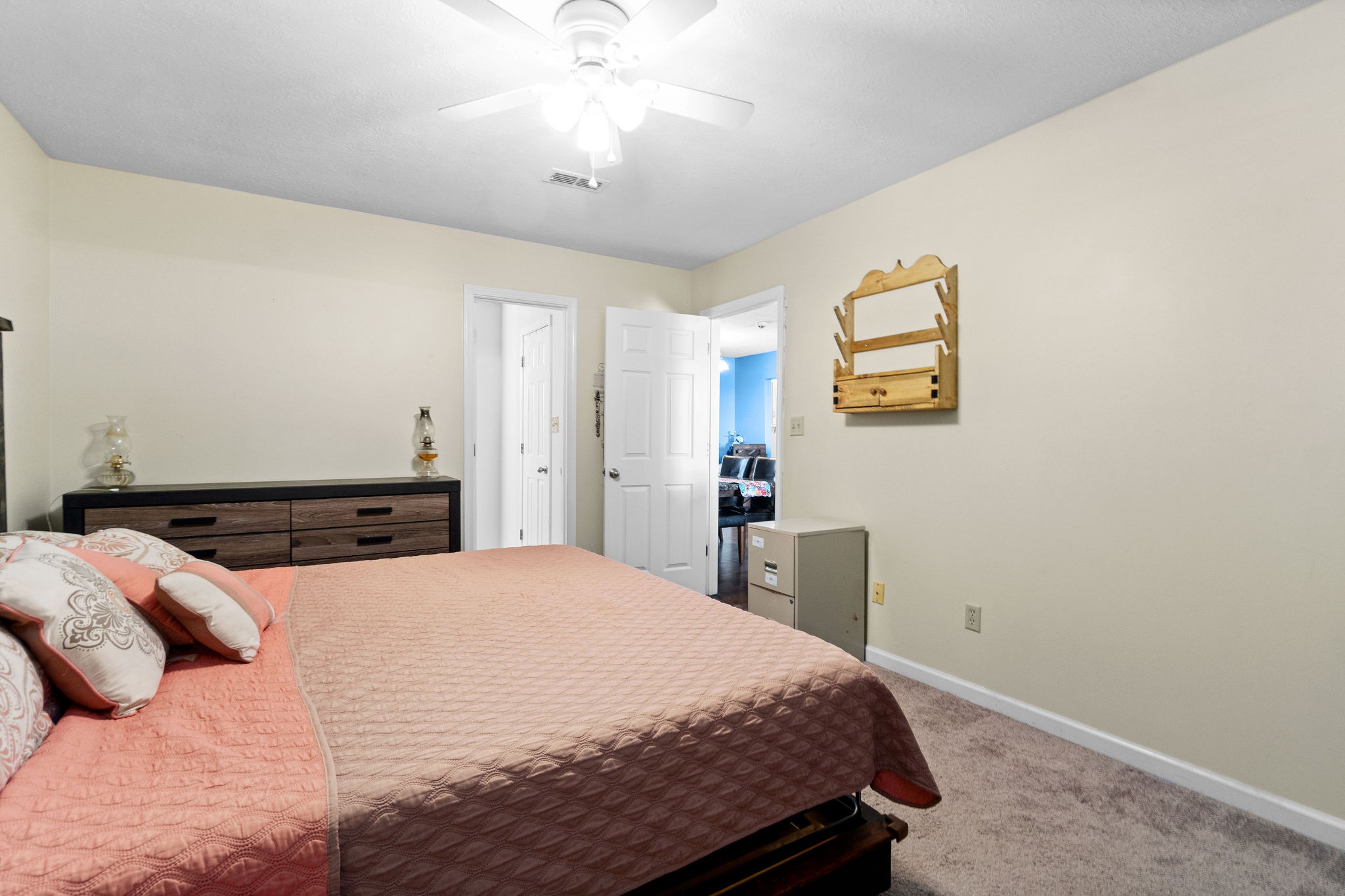 916 Hugh Hunter Road Oak Grove, KY 42262 - Photo 14 of 30 a bedroom with a bed and a chandelier