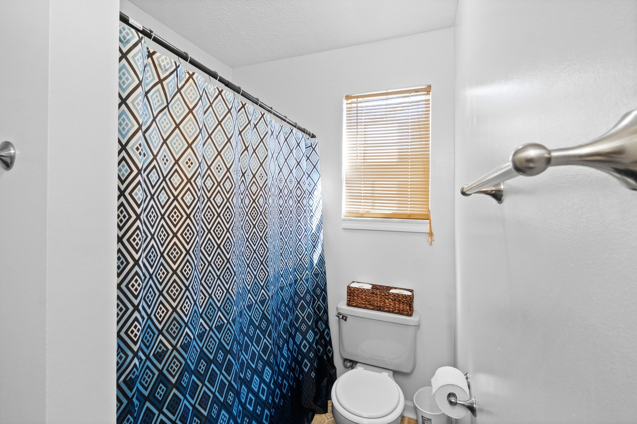 916 Hugh Hunter Road Oak Grove, KY 42262 - Photo 19 of 30 a bathroom with a toilet and a shower curtain