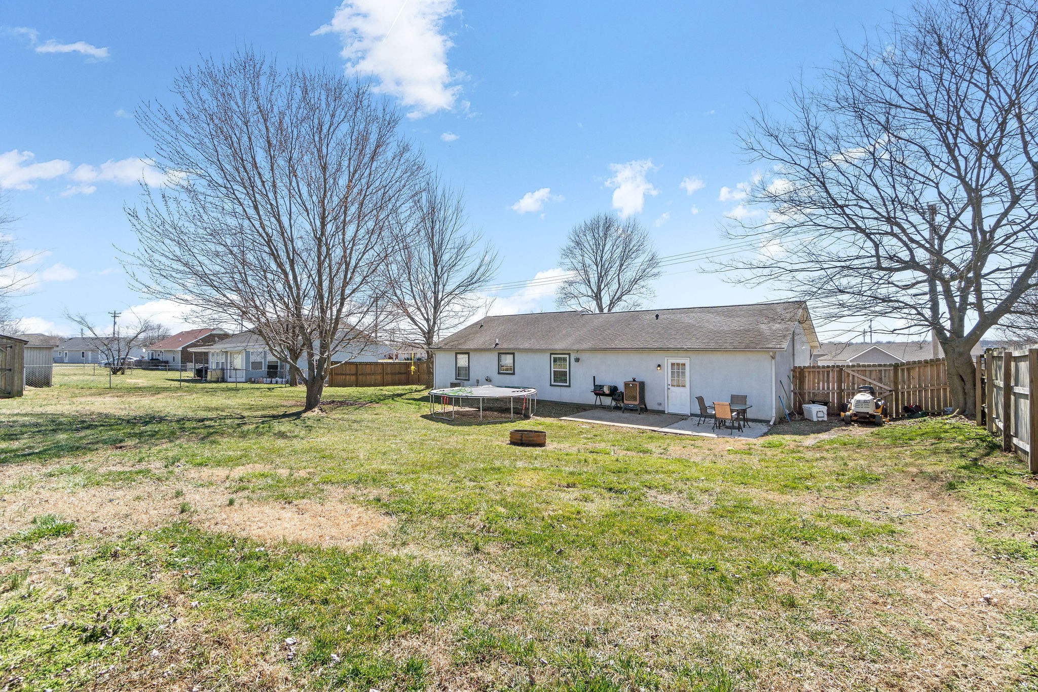 916 Hugh Hunter Road Oak Grove, KY 42262 - Photo 23 of 30 a view of a house with a big yard and large tree