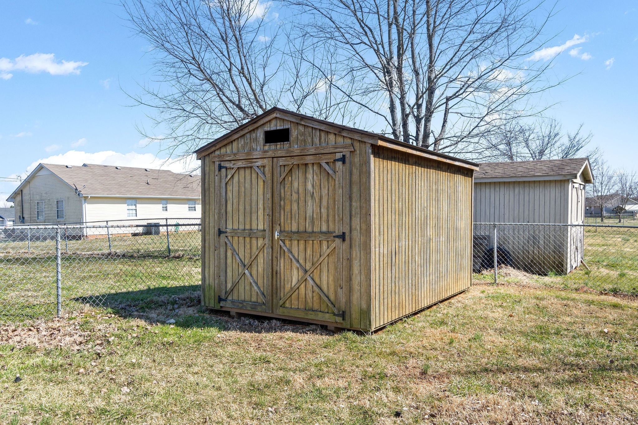 916 Hugh Hunter Road Oak Grove, KY 42262 - Photo 26 of 30 a backyard of a house with a small yard and wooden fence