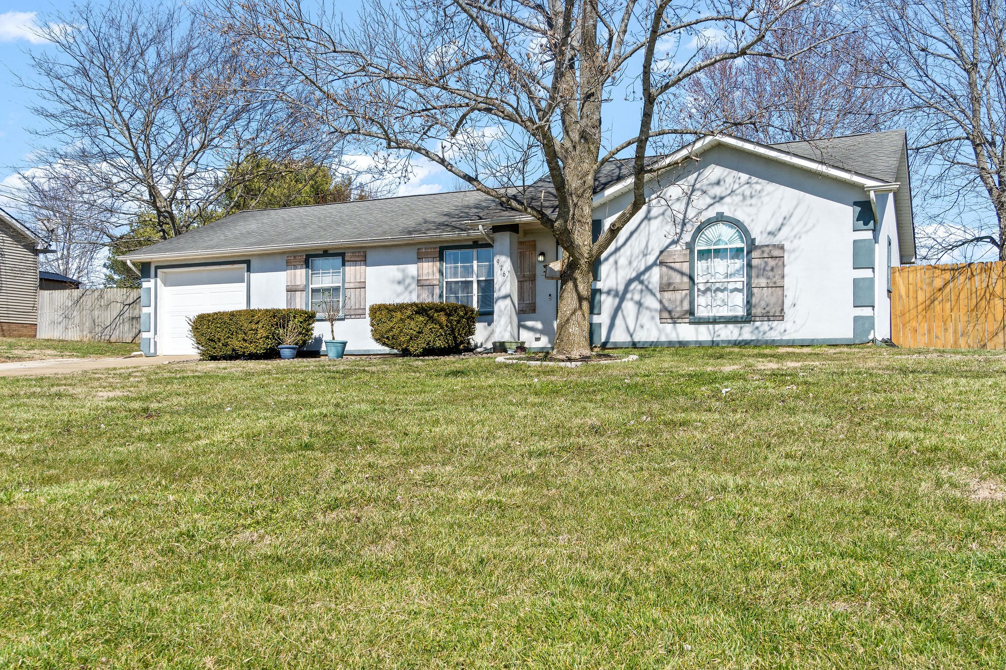 916 Hugh Hunter Road Oak Grove, KY 42262 - Photo 30 of 30 a white house that has a tree in front of it