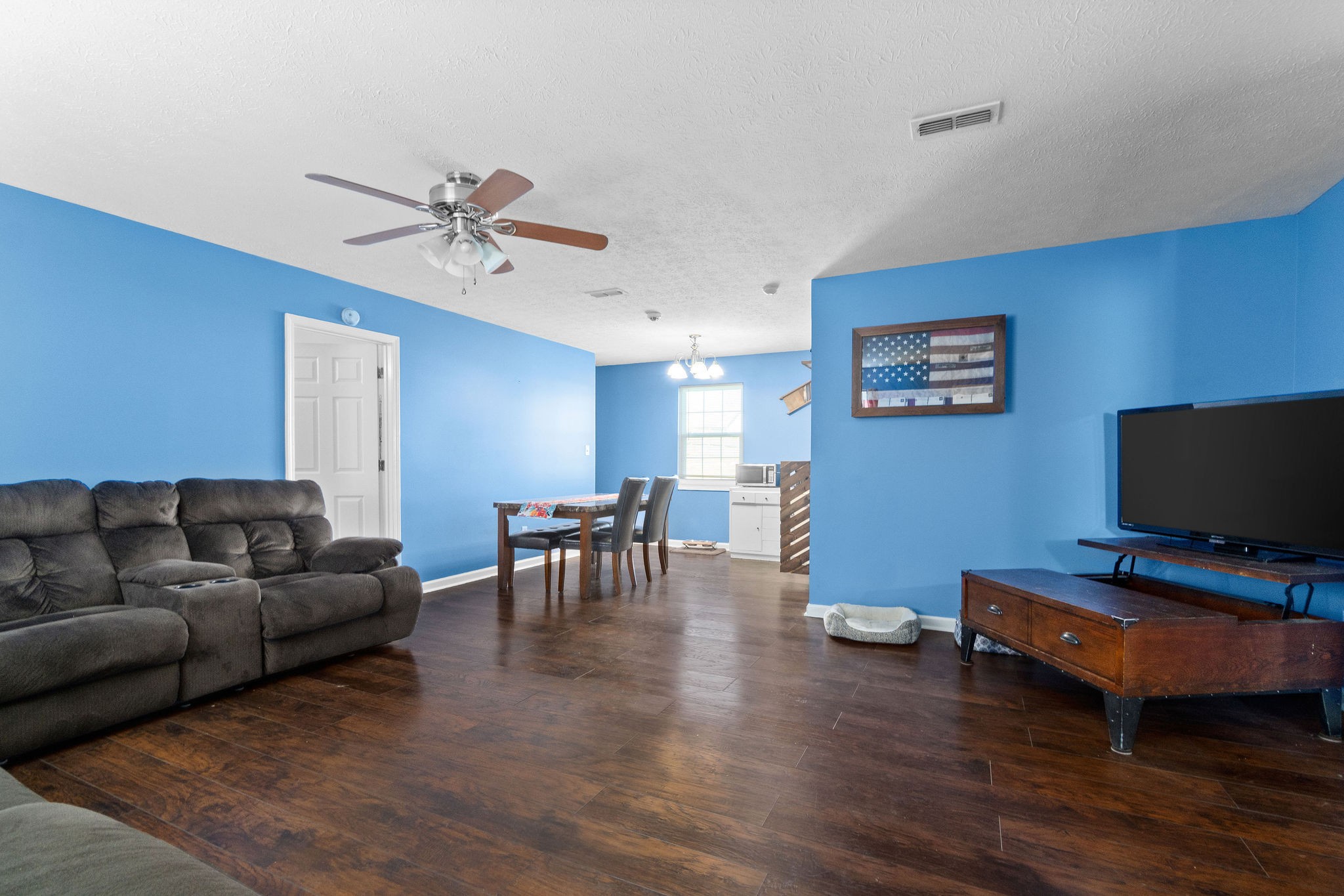 916 Hugh Hunter Road Oak Grove, KY 42262 - Photo 4 of 30 a living room with furniture and a flat screen tv
