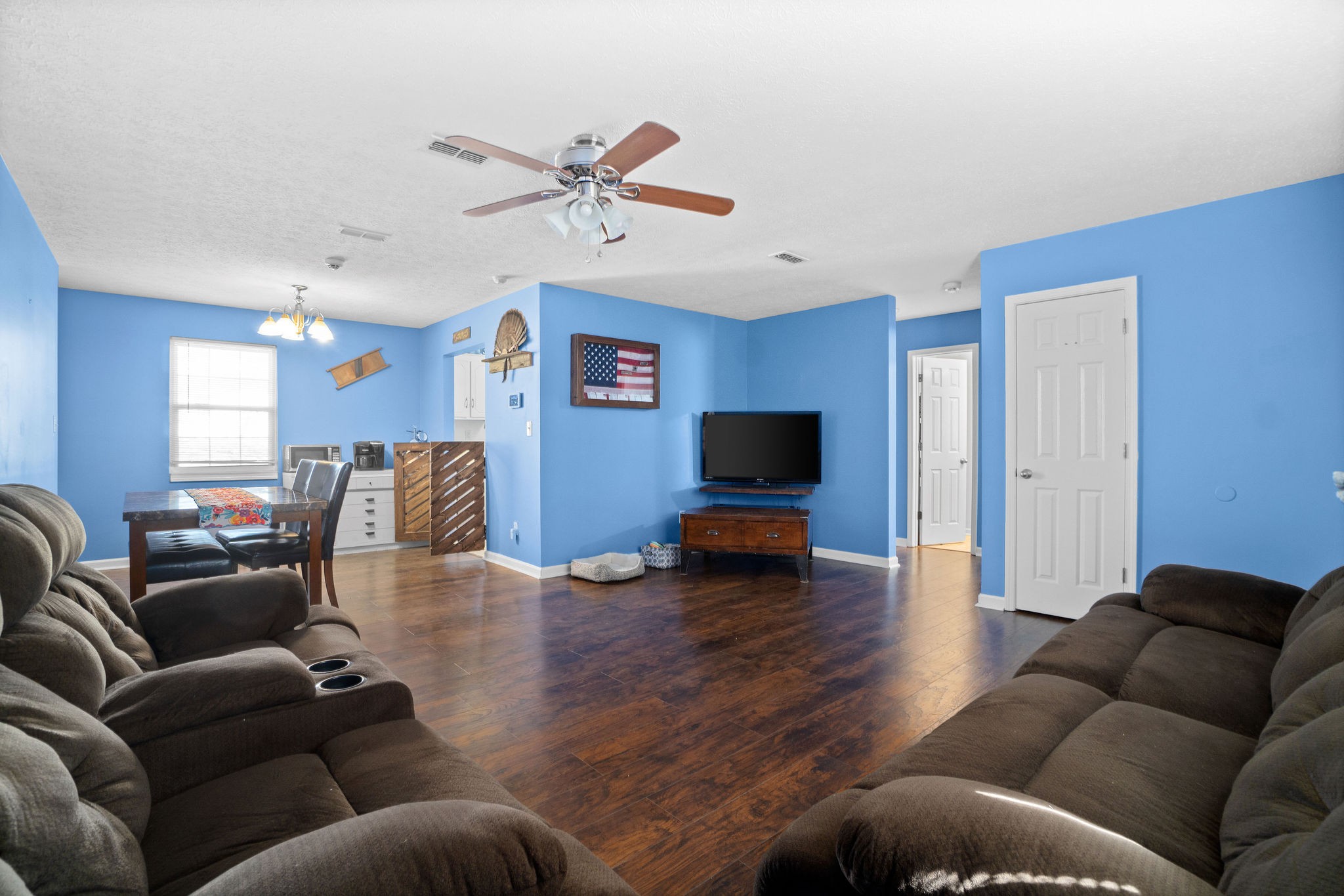 916 Hugh Hunter Road Oak Grove, KY 42262 - Photo 5 of 30 a living room with furniture and a flat screen tv