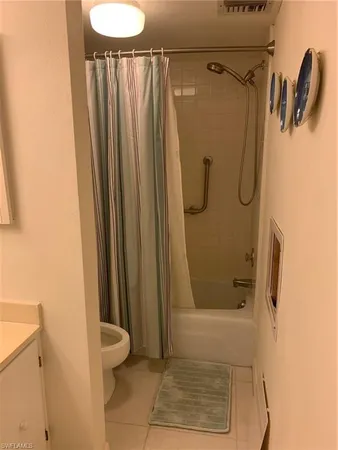 a bathroom with a shower and a toilet