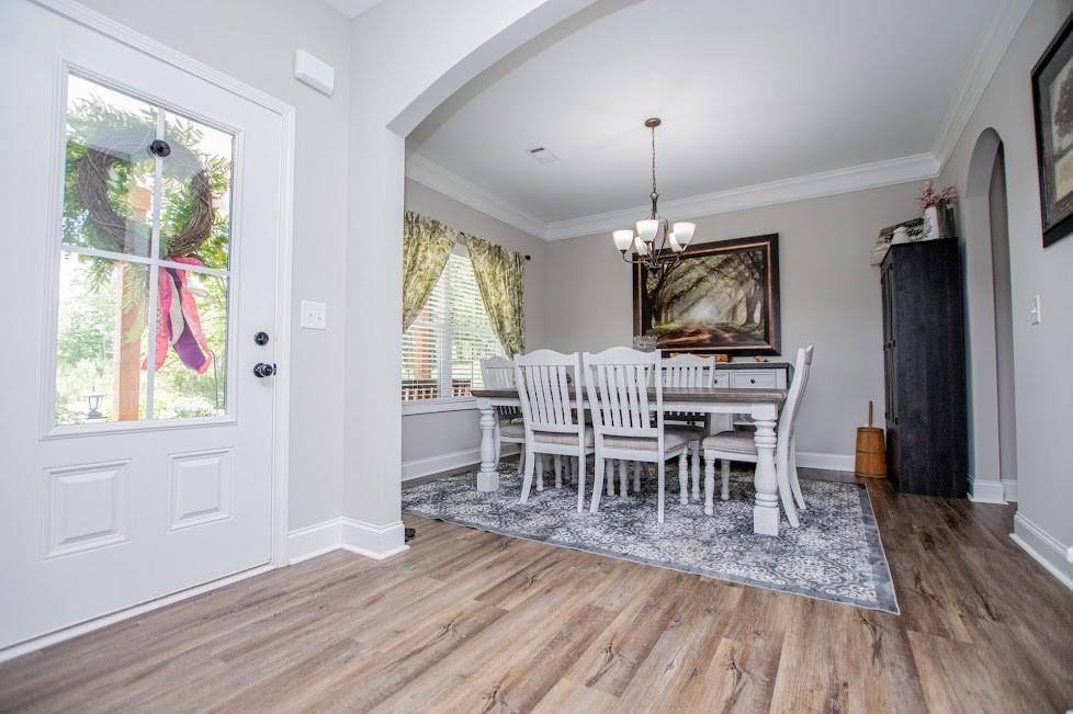 1851 McGarity Road Temple, GA 30179 - Photo 13 of 94 a view of a dining room with furniture window and wooden floor