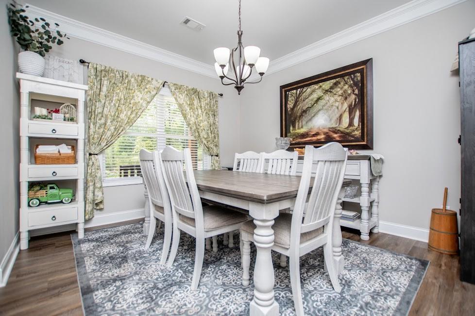 1851 McGarity Road Temple, GA 30179 - Photo 14 of 94 a dining room with furniture a window and a chandelier