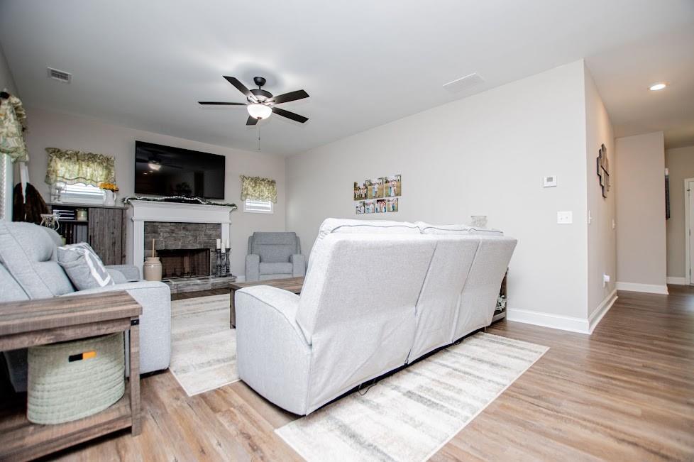 1851 McGarity Road Temple, GA 30179 - Photo 19 of 94 a living room with furniture a flat screen tv and a fireplace