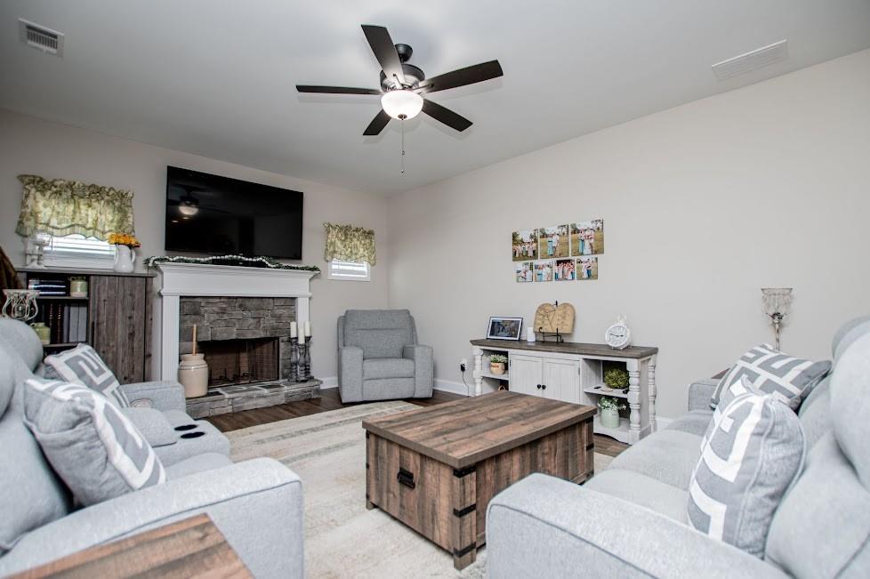 1851 McGarity Road Temple, GA 30179 - Photo 20 of 94 a living room with furniture a flat screen tv and a fireplace