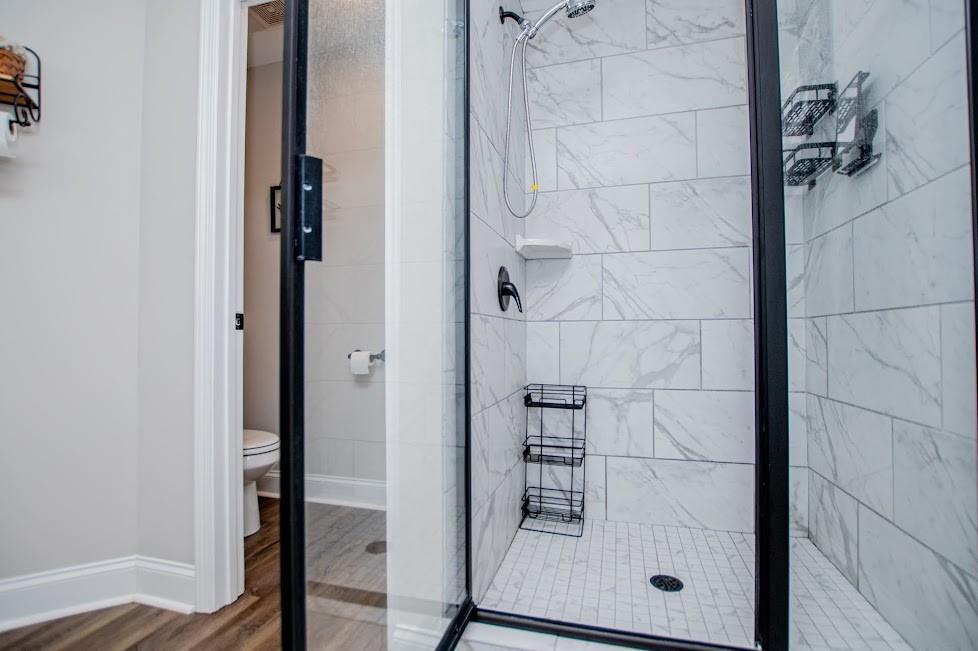 1851 McGarity Road Temple, GA 30179 - Photo 30 of 94 a bathroom with a glass shower door