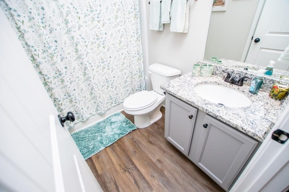 1851 McGarity Road Temple, GA 30179 - Photo 39 of 94 a bathroom with a granite countertop sink toilet and mirror
