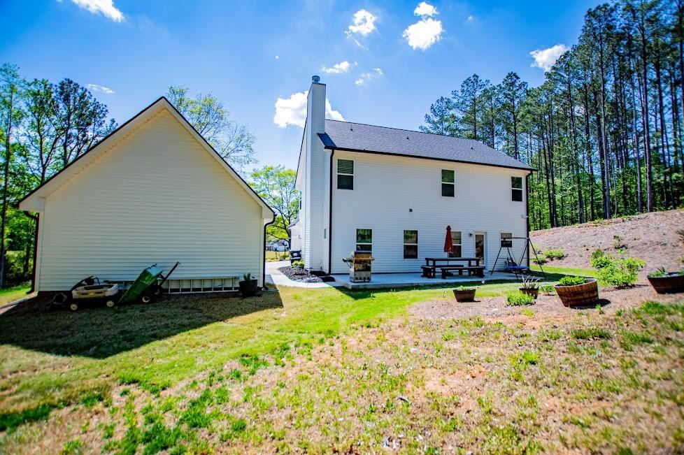 1851 McGarity Road Temple, GA 30179 - Photo 65 of 94 a view of swimming pool with outdoor seating and house in the background
