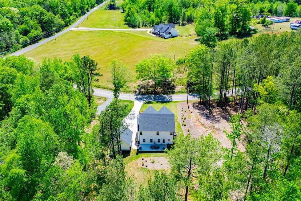 1851 McGarity Road Temple, GA 30179 - Photo 84 of 94 an aerial view of a house with a yard and lake view
