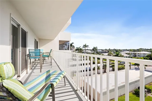 a view of balcony with furniture