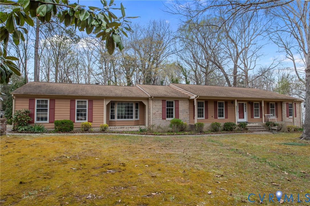 9440 Deerpark Court Midlothian, VA 23112 - Photo 1 of 55 a front view of a house with a garden