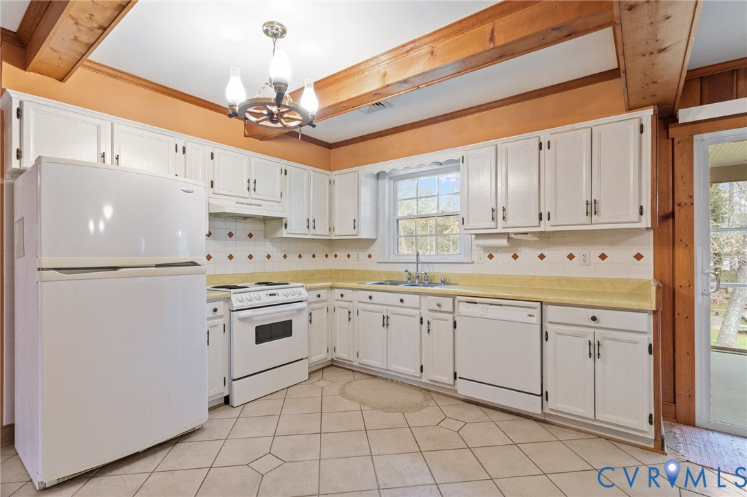 9440 Deerpark Court Midlothian, VA 23112 - Photo 14 of 55 a kitchen with granite countertop cabinets and white stainless steel appliances