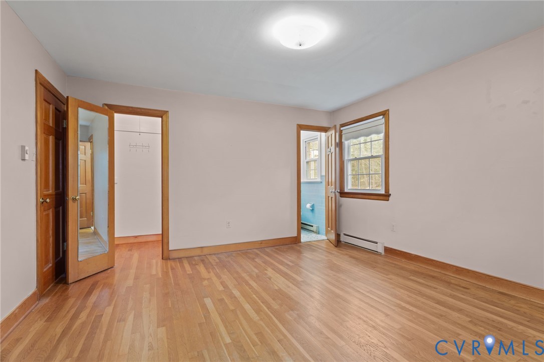 9440 Deerpark Court Midlothian, VA 23112 - Photo 21 of 55 an empty room with wooden floor and windows