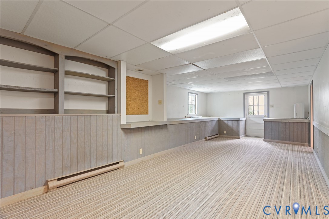 9440 Deerpark Court Midlothian, VA 23112 - Photo 28 of 55 a view of an empty room with a window and wooden floor