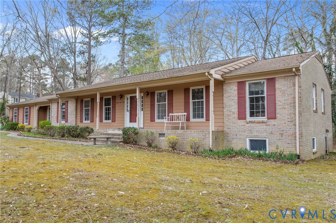 9440 Deerpark Court Midlothian, VA 23112 - Photo 3 of 55 a front view of a house with a garden