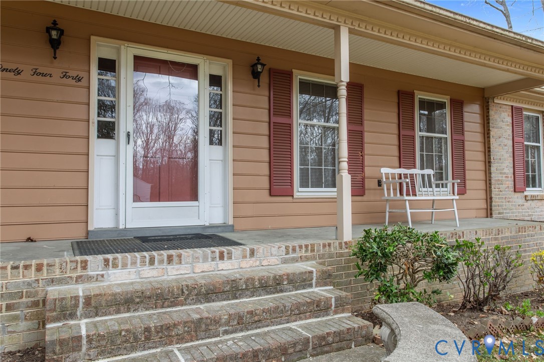 9440 Deerpark Court Midlothian, VA 23112 - Photo 37 of 55 a front view of a house with a yard