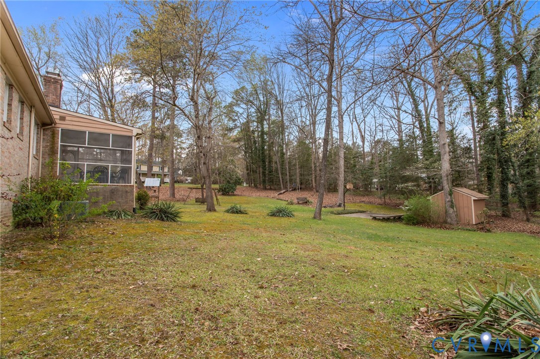 9440 Deerpark Court Midlothian, VA 23112 - Photo 40 of 55 a view of a house with backyard and trees