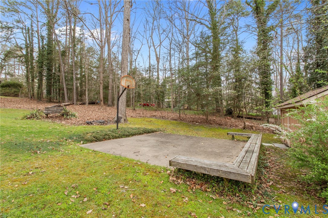 9440 Deerpark Court Midlothian, VA 23112 - Photo 42 of 55 a view of yard with swimming pool
