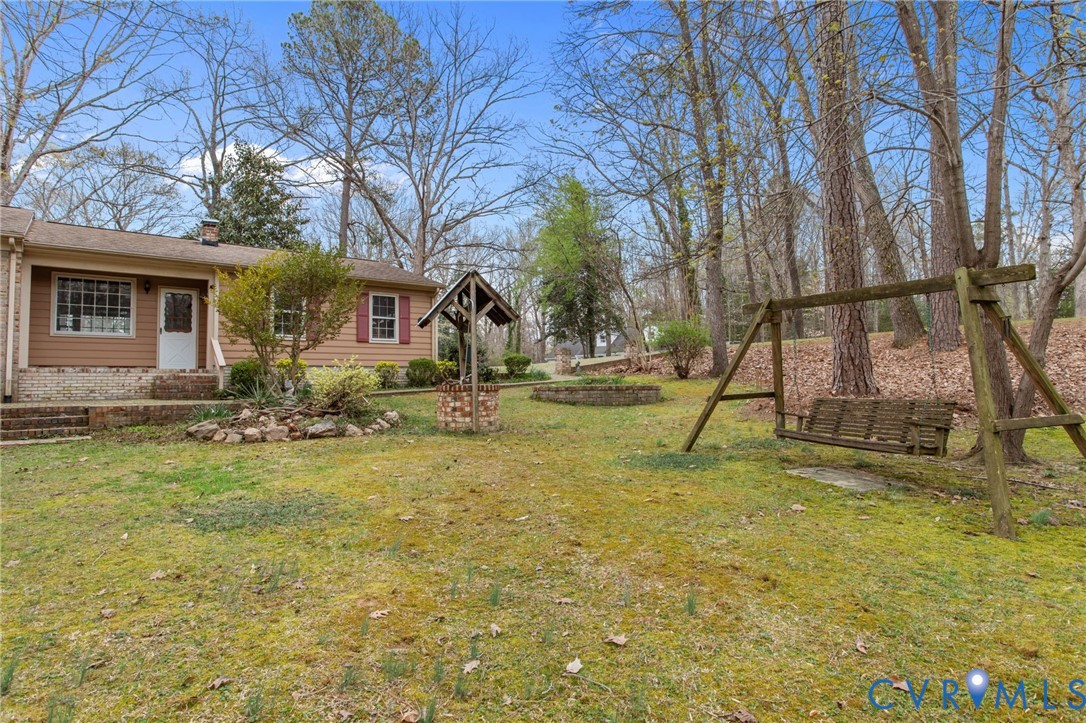 9440 Deerpark Court Midlothian, VA 23112 - Photo 45 of 55 a view of a house with backyard and tree