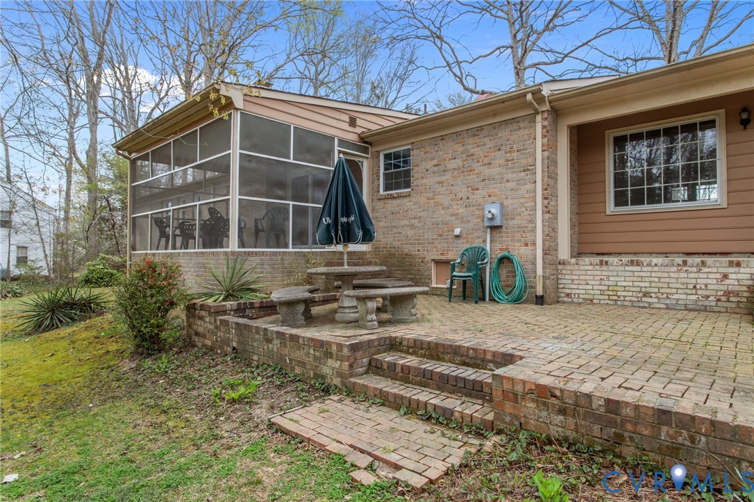 9440 Deerpark Court Midlothian, VA 23112 - Photo 46 of 55 a front view of a house with garden