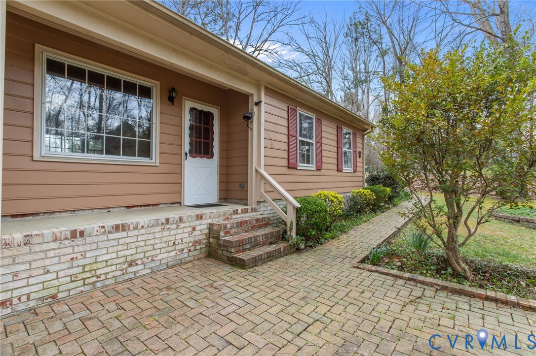 9440 Deerpark Court Midlothian, VA 23112 - Photo 49 of 55 a front view of a house with a yard