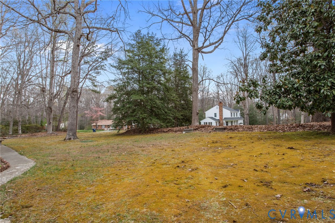 9440 Deerpark Court Midlothian, VA 23112 - Photo 53 of 55 a view of a yard with a house