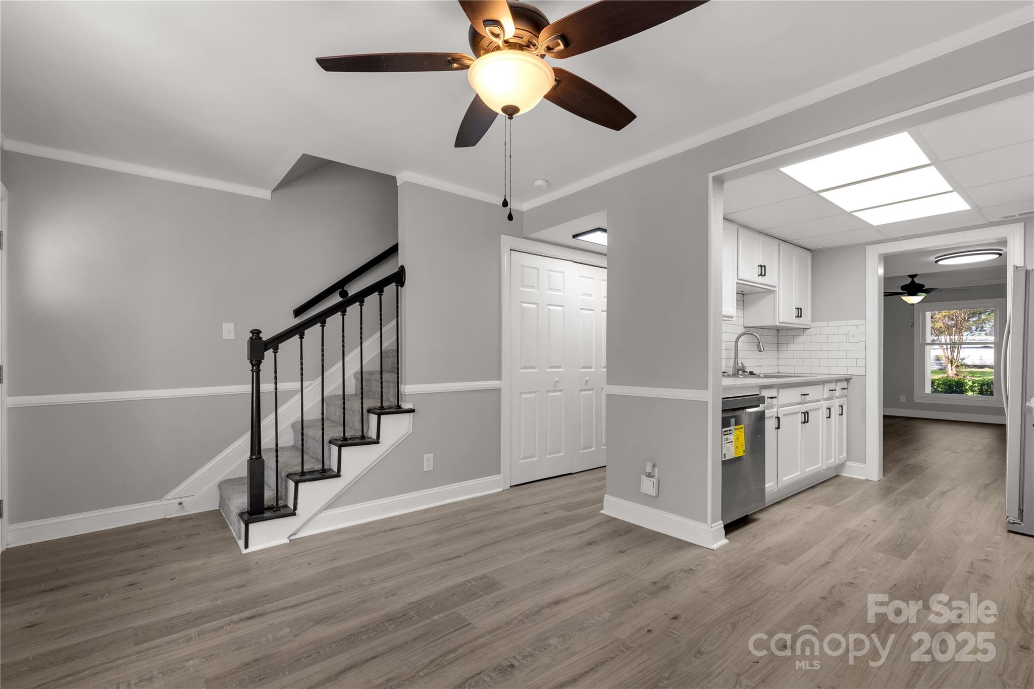 1830 Ebenezer Road Rock Hill, SC 29732 - Photo 14 of 23 a open kitchen with a white stove top oven and a dishwasher with wooden floor