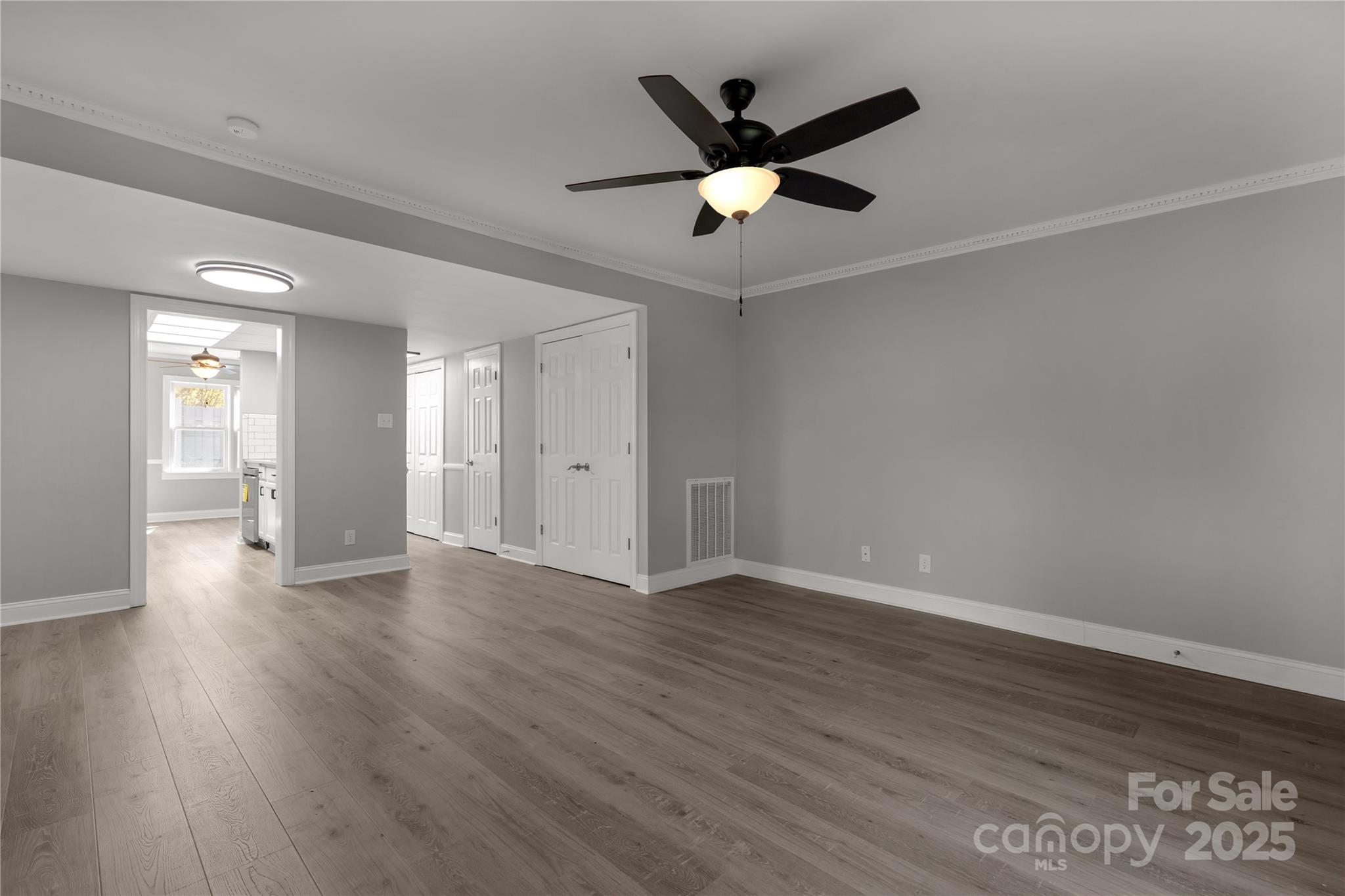 1830 Ebenezer Road Rock Hill, SC 29732 - Photo 8 of 23 a view of an empty room with wooden floor and a ceiling fan