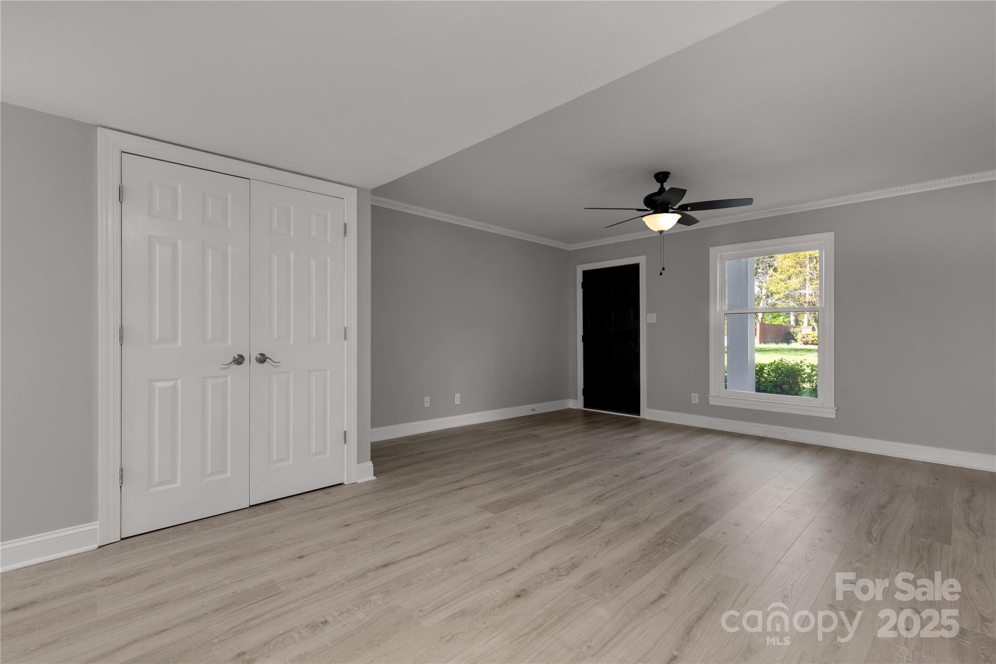 1830 Ebenezer Road Rock Hill, SC 29732 - Photo 9 of 23 a view of an empty room with wooden floor and a window