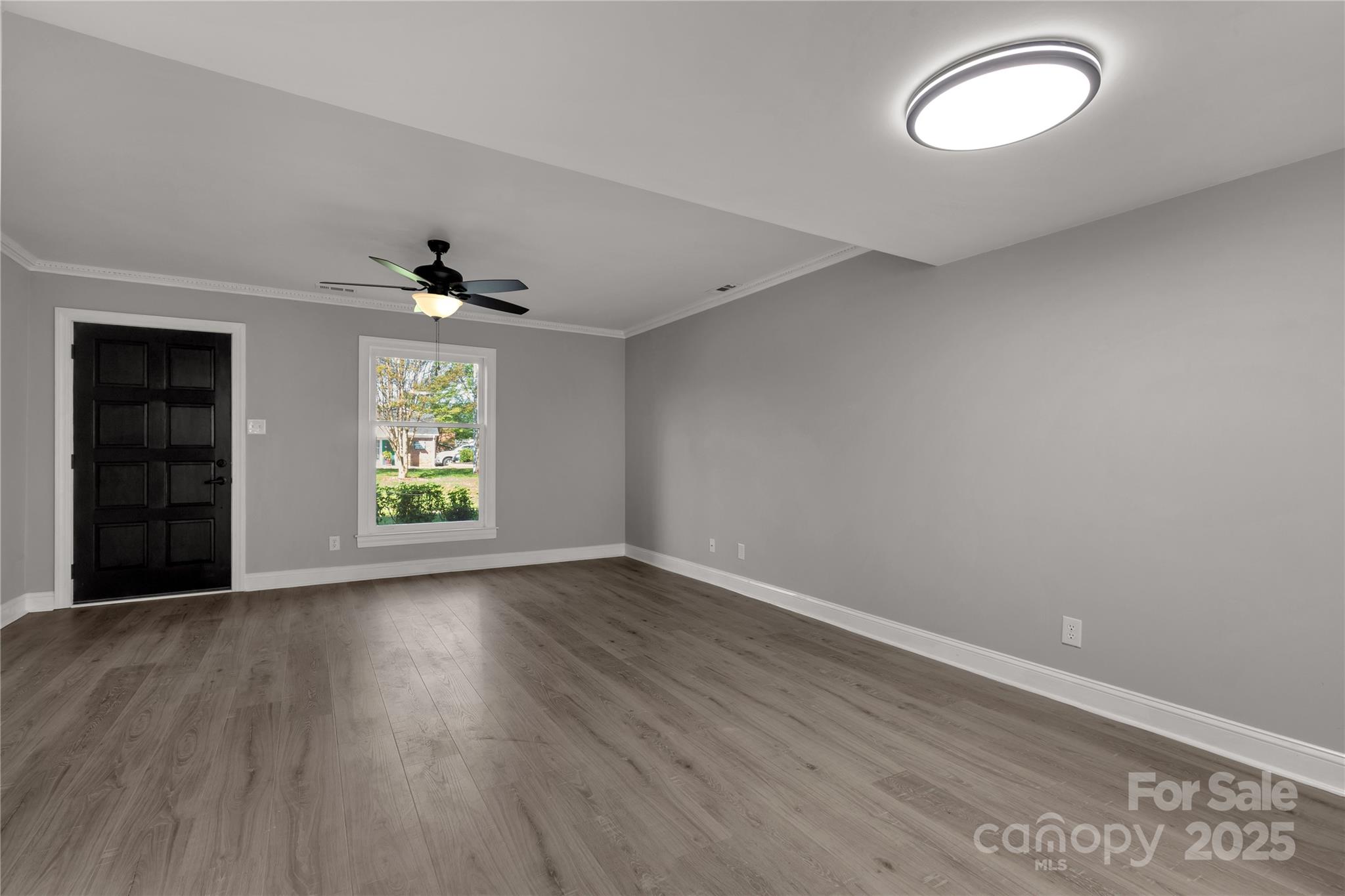 1830 Ebenezer Road Rock Hill, SC 29732 - Photo 10 of 23 an empty room with wooden floor and windows