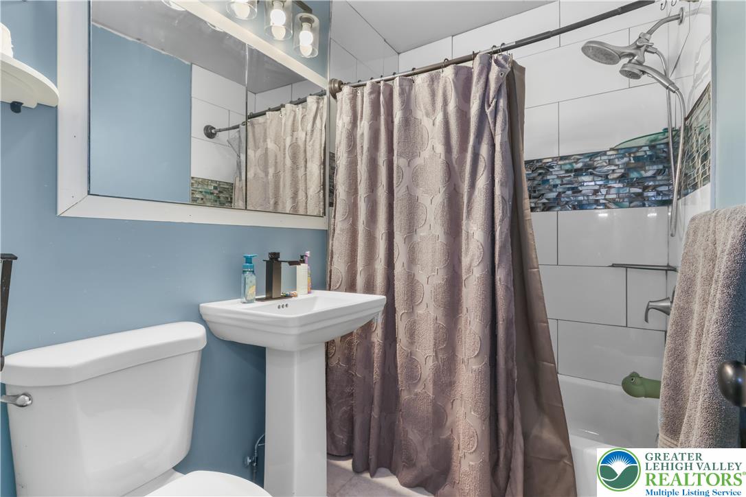 1042 Neffs Laurys Road Laurys Station, PA 18059 - Photo 22 of 27 a bathroom with a sink toilet and shower