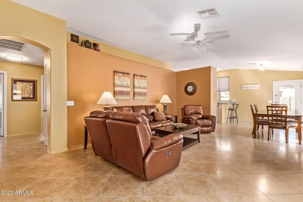 a living room with furniture flat screen tv and a fireplace