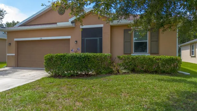 a view of a house with a garden