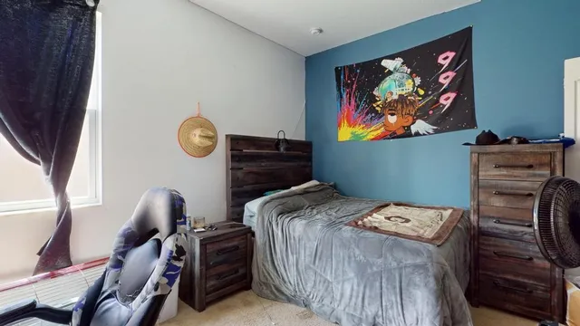 a bedroom with a bed and furniture