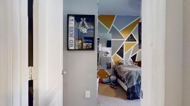 a view of an entryway with wooden floor