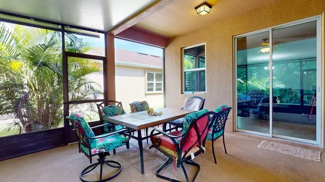a bathroom with a tub and glass door