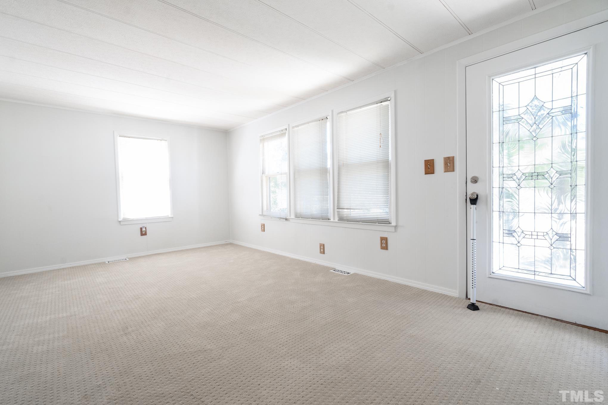 109 Old Watkins Road Henderson, NC 27537 - Photo 12 of 12 a view of an empty room with a window